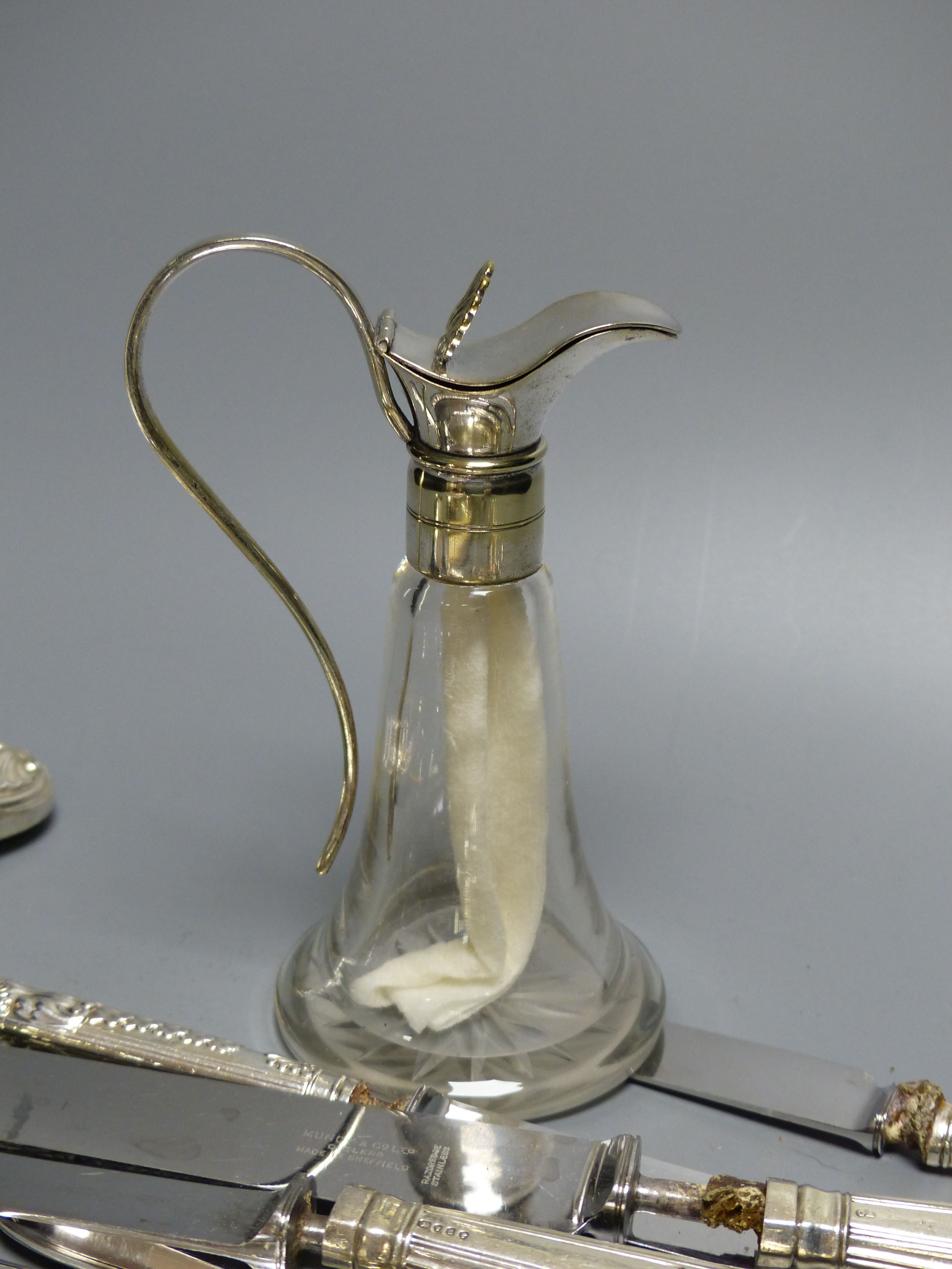 A small collection of silver and plated flatware, including a pair of silver Kings pattern jam spoons,